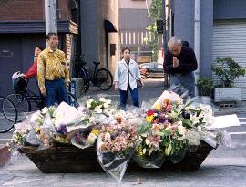 Flowers piled near site of fatal stabbing of Tokyo student